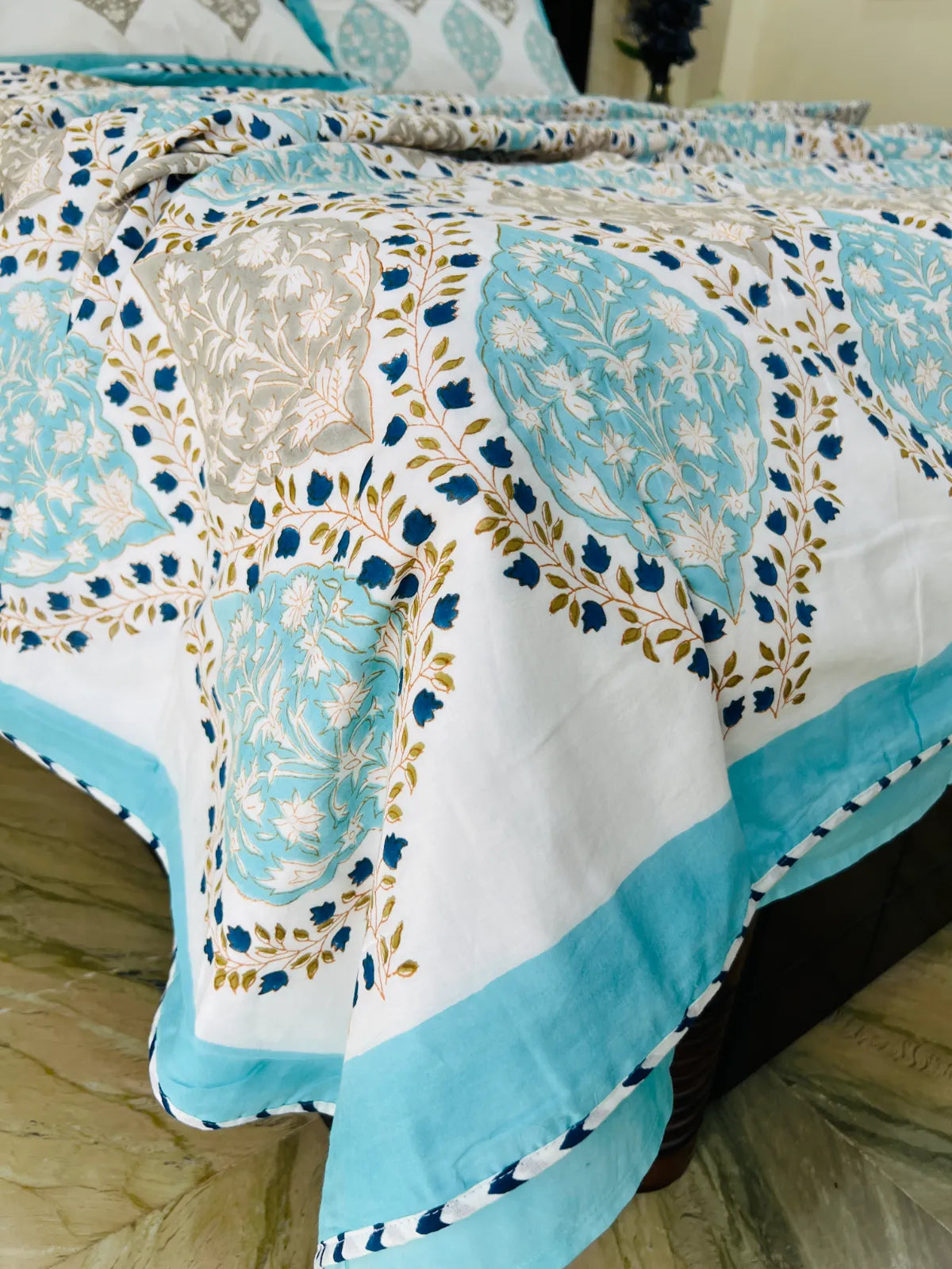 Folded Jaipur Jewel muslin cotton dohar with handblock printed floral motifs