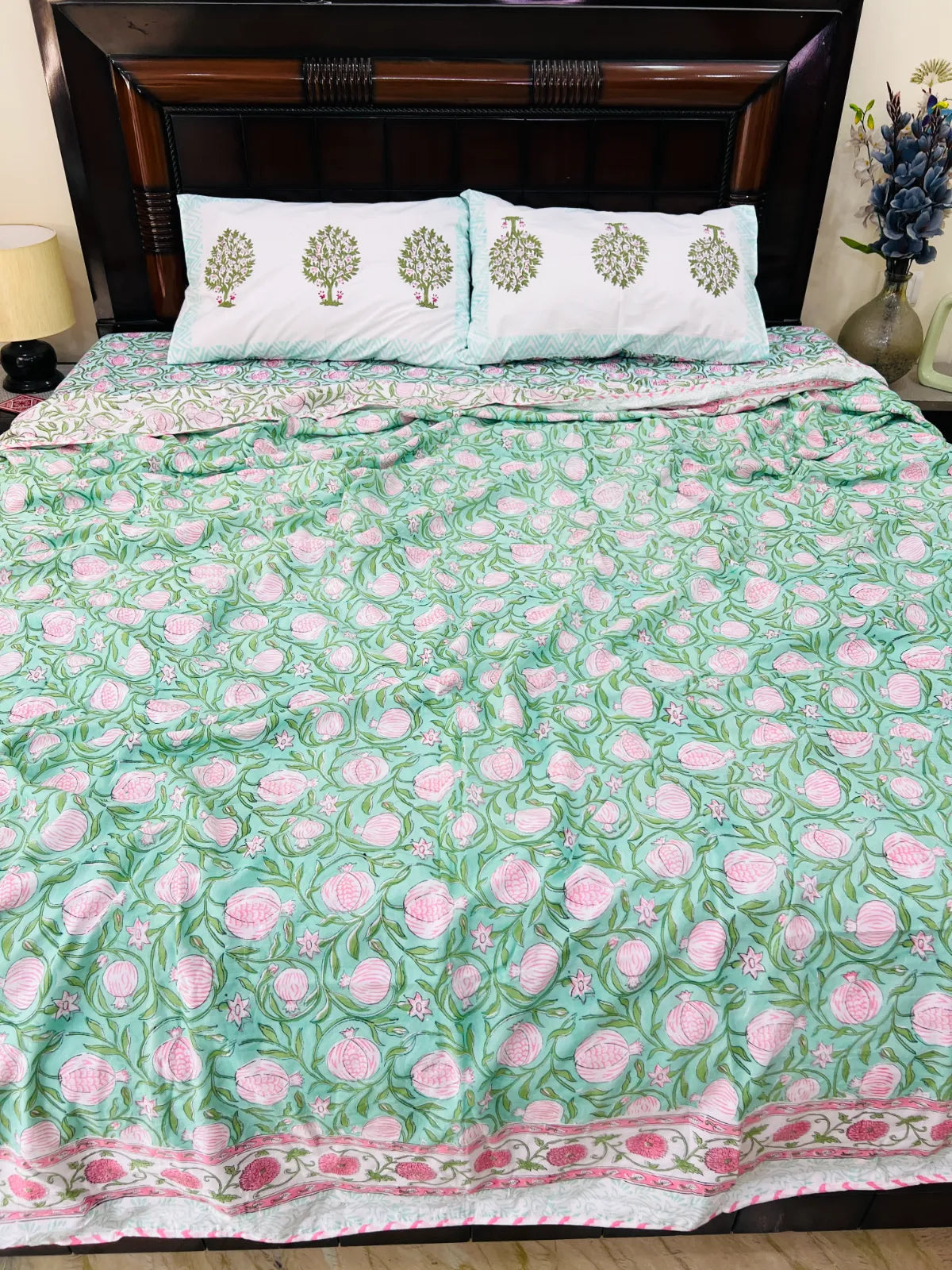 Close-up of pink pomegranate floral handblock print on muslin cotton dohar