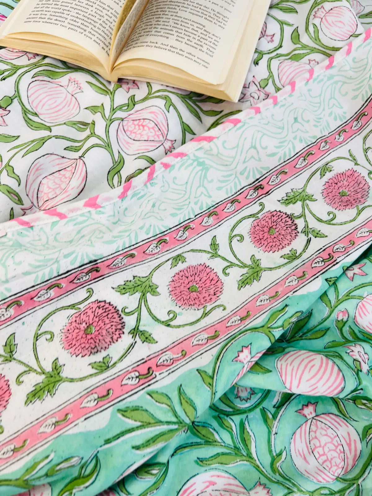 Close-up of pink pomegranate floral handblock print on muslin cotton dohar