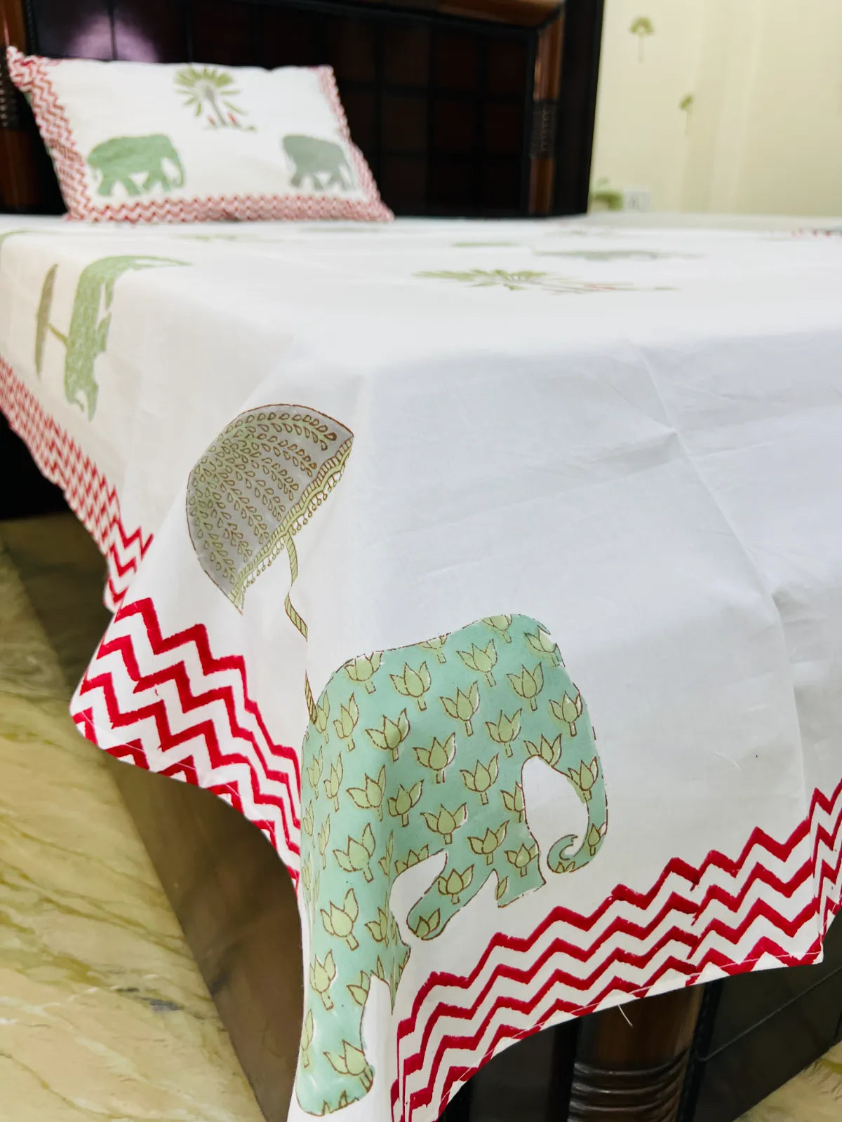 Handmade single bedsheet with elephant and palm tree design.