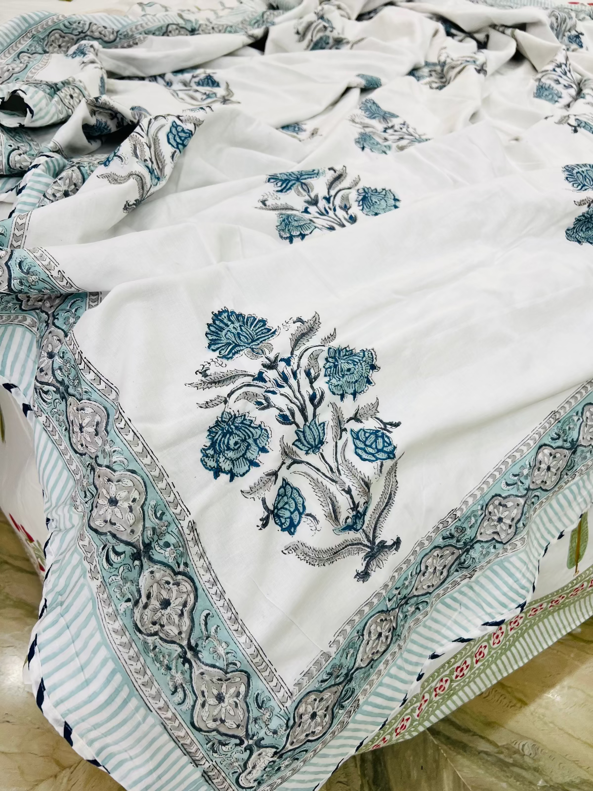 Embroidered fabric with floral patterns on a wooden surface