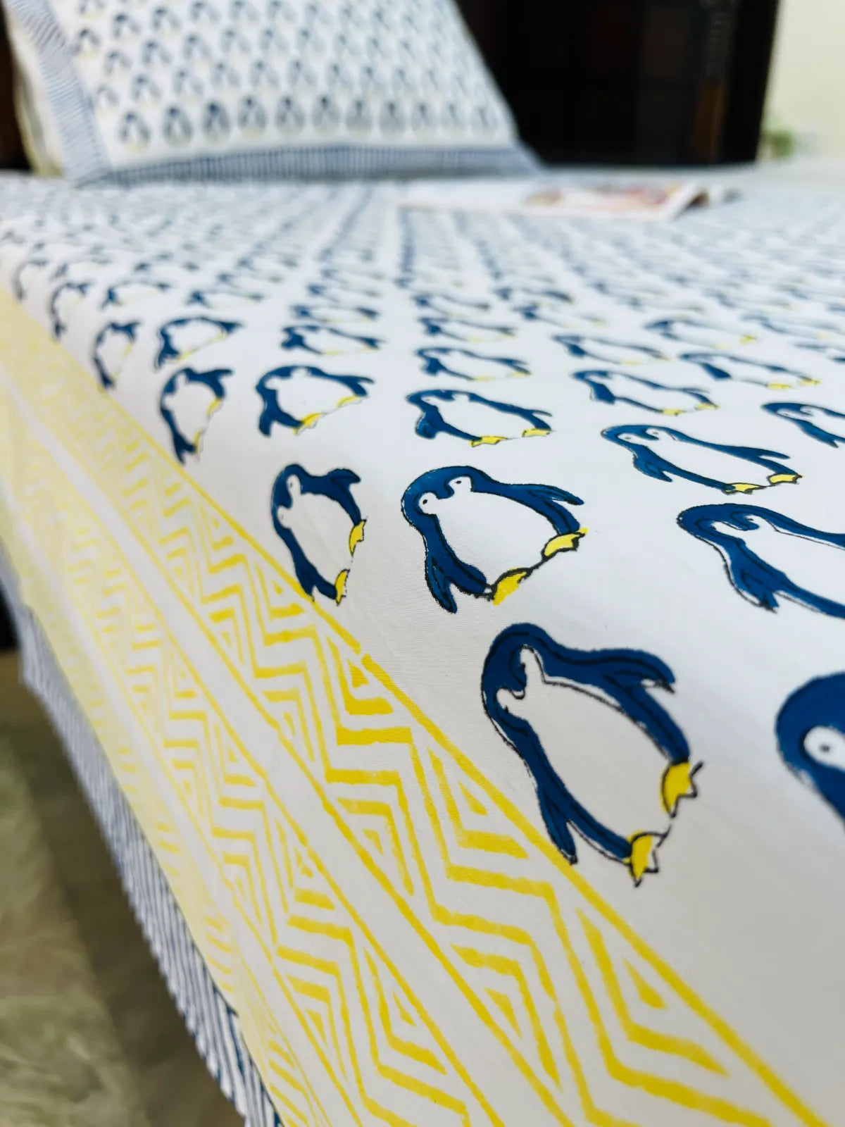 White cotton bedsheet with penguin print and pillow cover