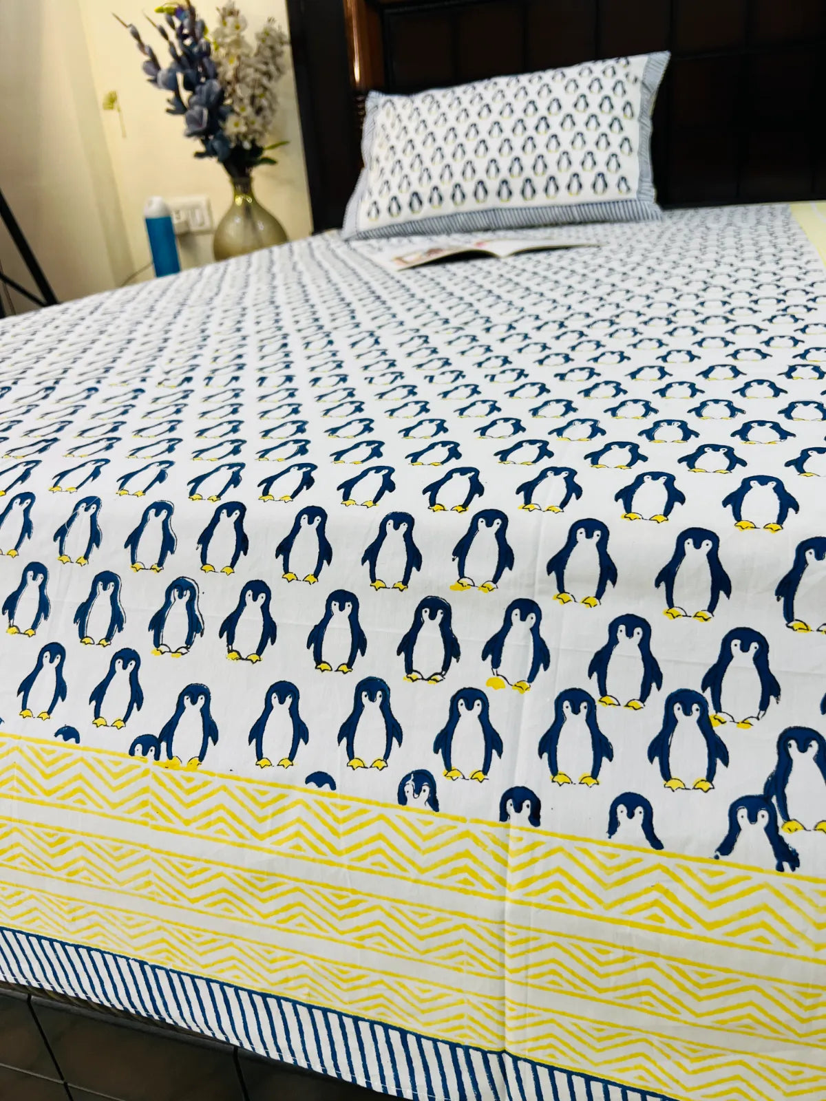 White cotton bedsheet with penguin print and pillow cover