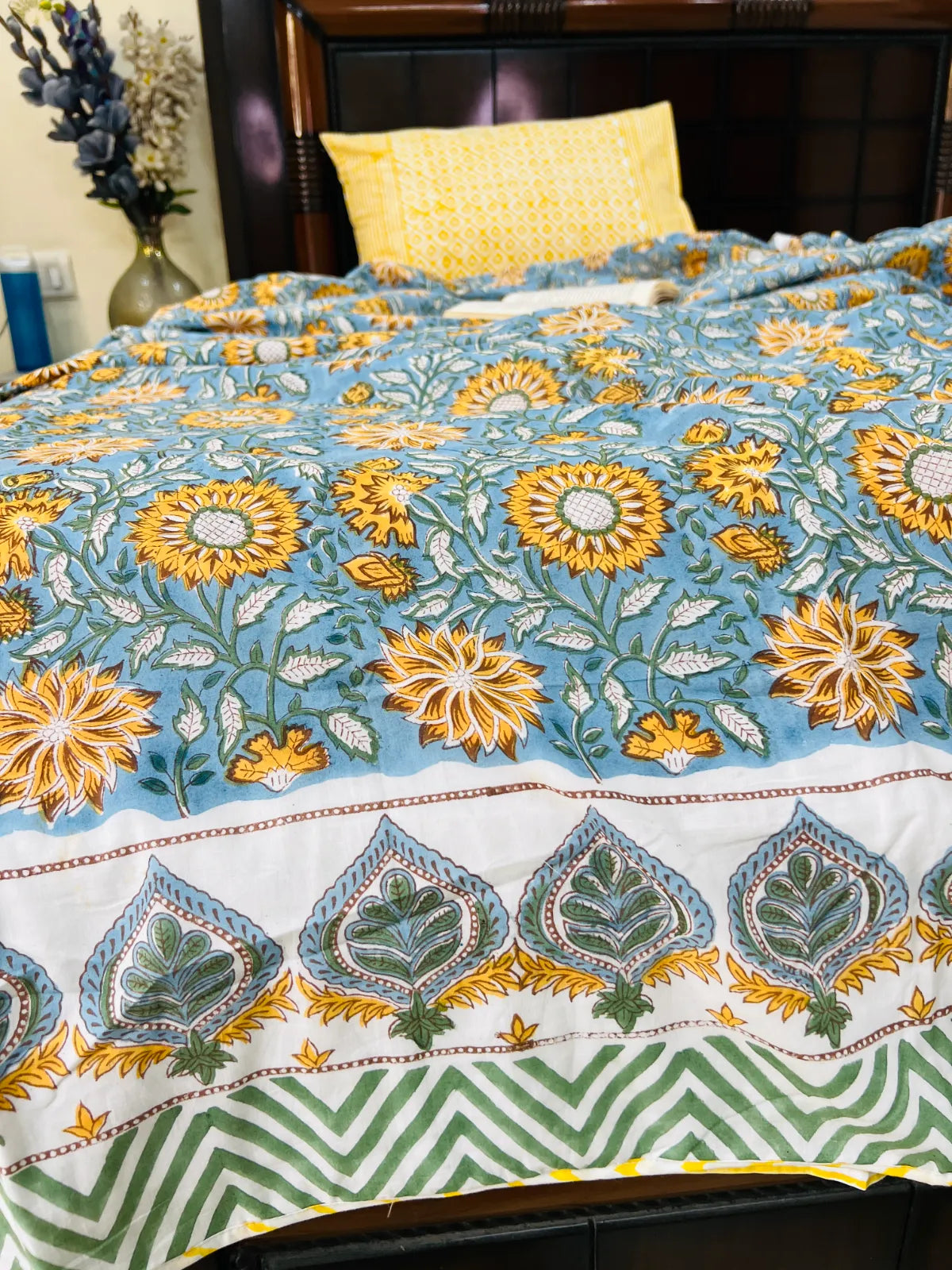 Handblock printed reversible muslin cotton dohar featuring sunflower floral motifs in blue and ivory by House Of Manjari.