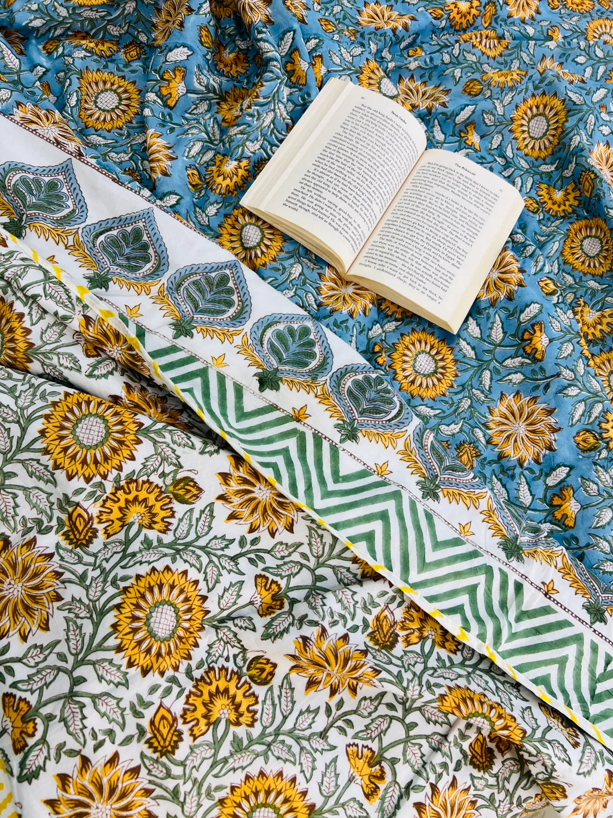 Handblock printed reversible muslin cotton dohar featuring sunflower floral motifs in blue and ivory by House Of Manjari.