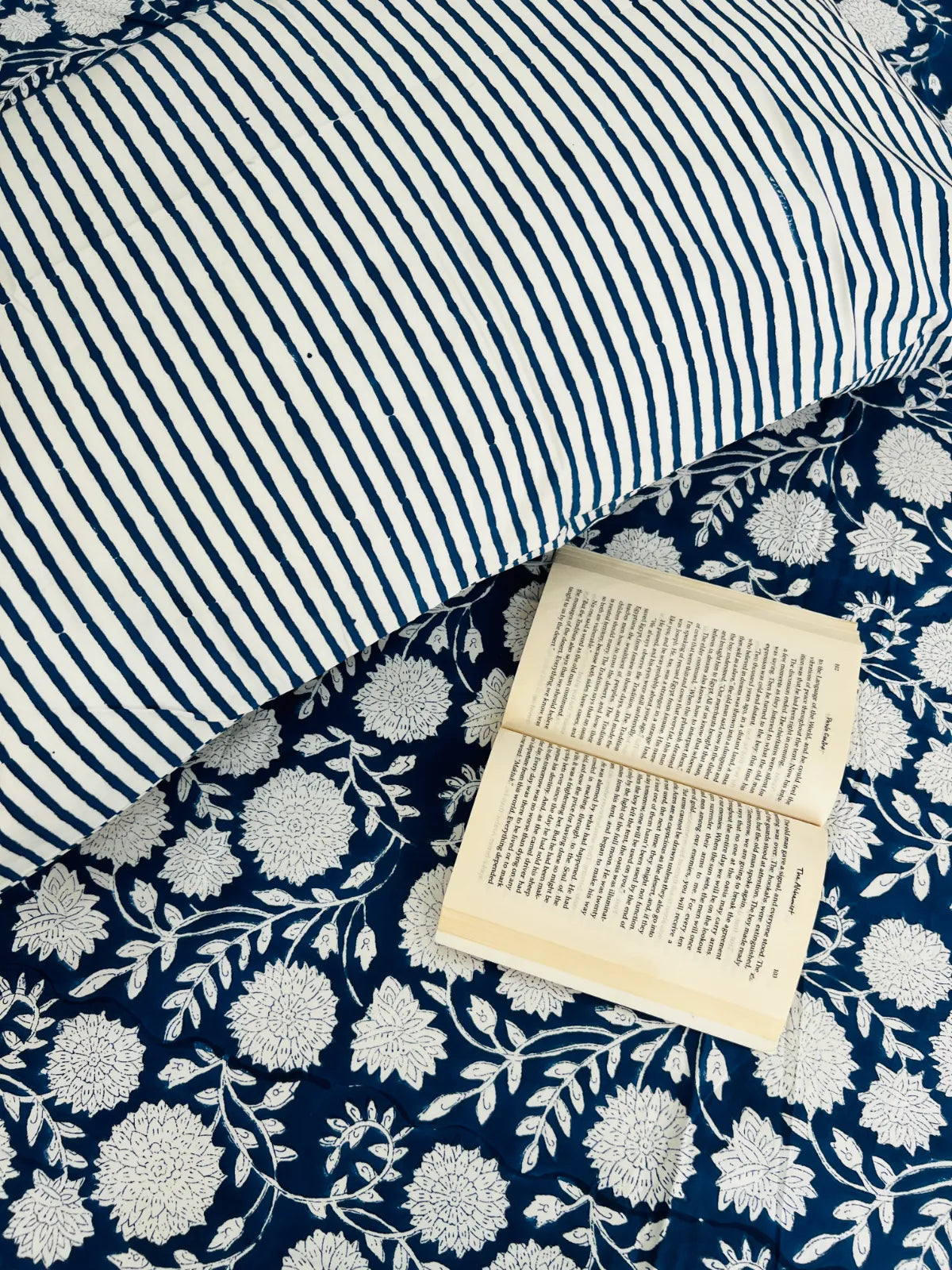 Blue floral single bedsheet in cotton with handblock print on bed