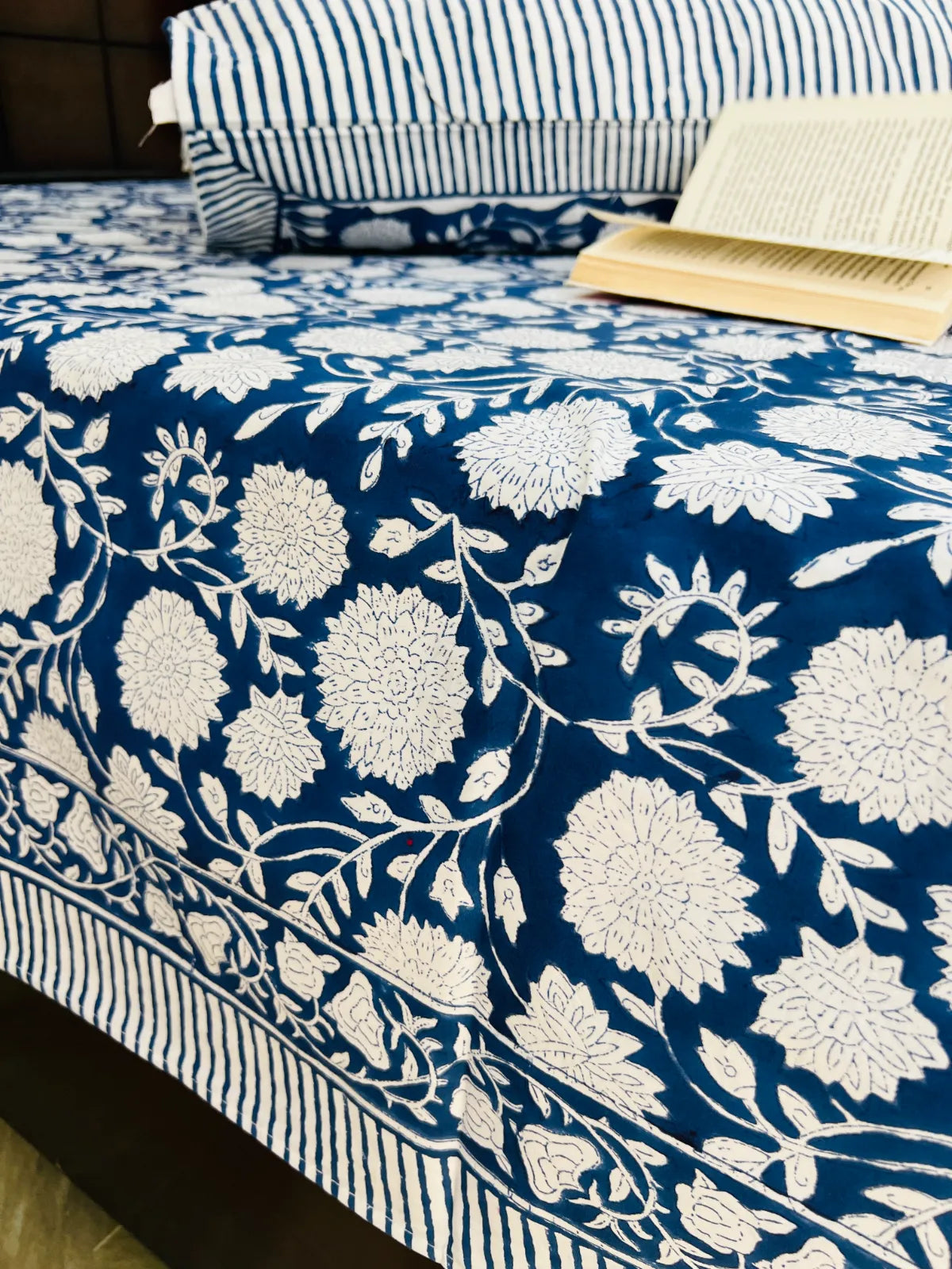 Elegant blue floral single bedsheet styled in bedroom