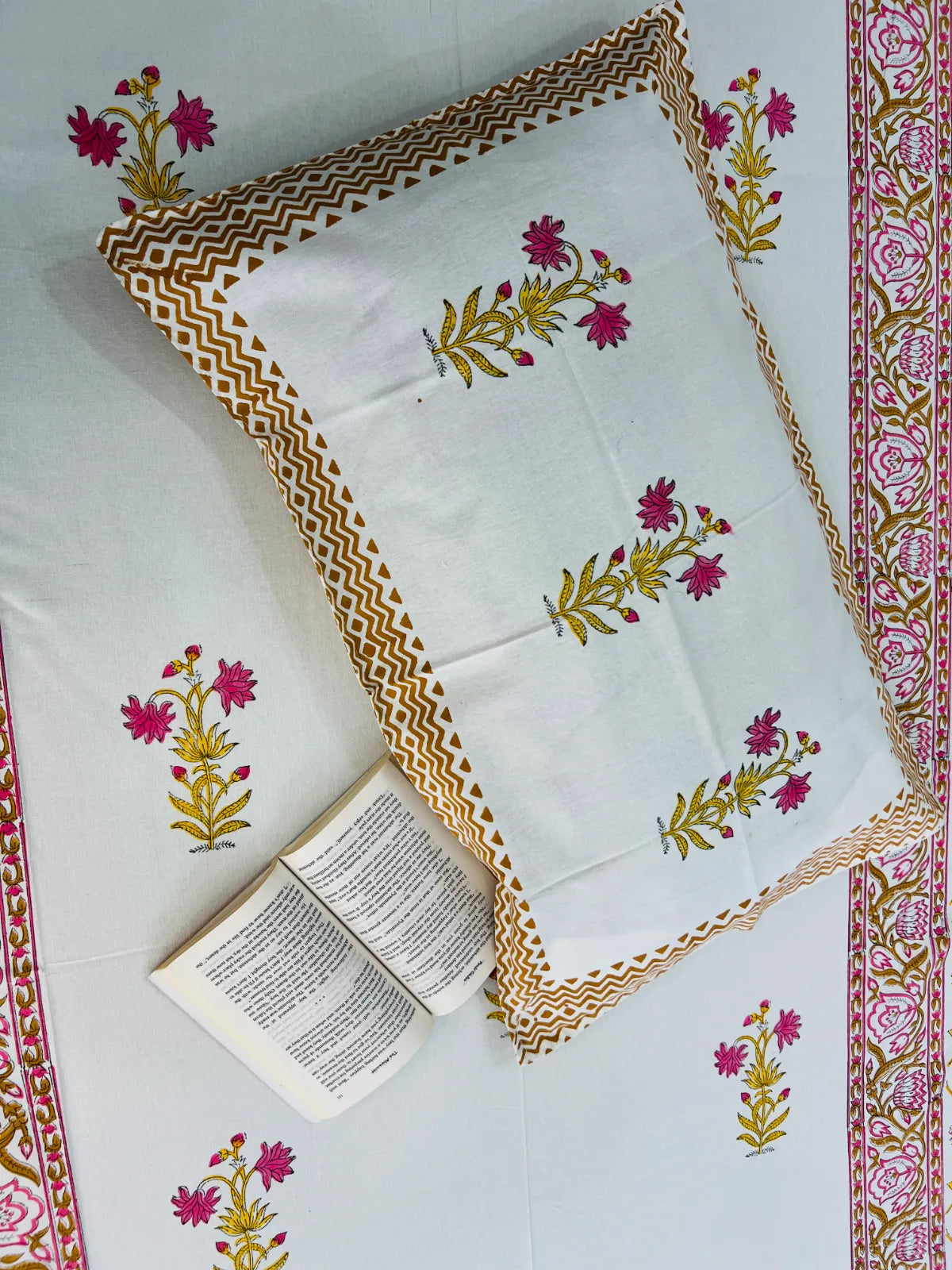 Handblock printed pure cotton single bedsheet featuring pink floral butis and a traditional Jaipuri floral border by House Of Manjari.