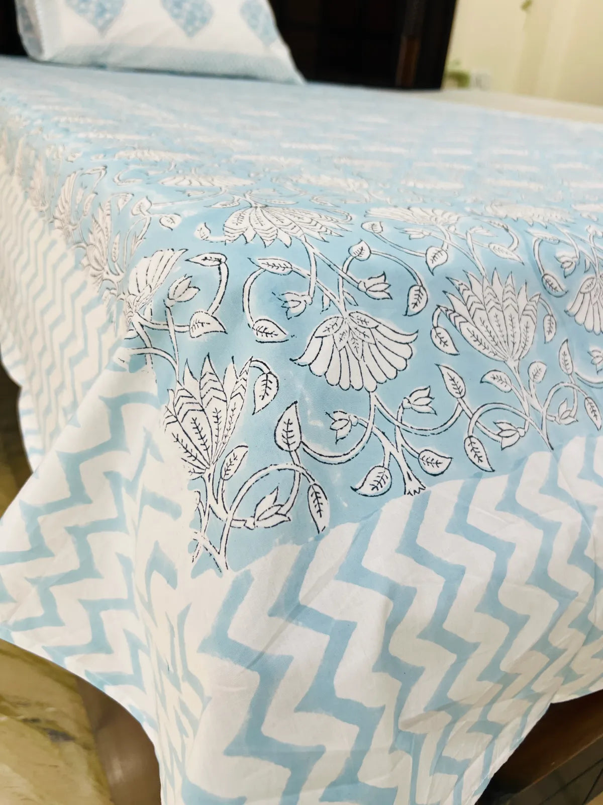 Handblock printed pure cotton single bedsheet featuring powder blue floral vines and Mughal-inspired floral medallions by House Of Manjari.