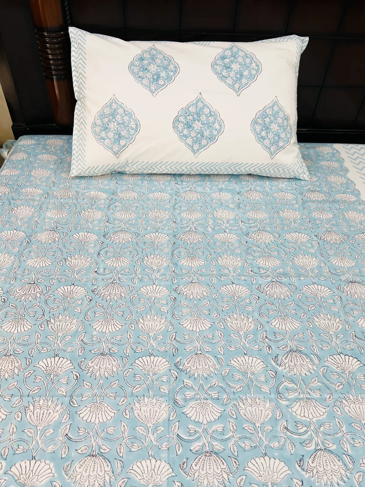 Handblock printed pure cotton single bedsheet featuring powder blue floral vines and Mughal-inspired floral medallions by House Of Manjari.