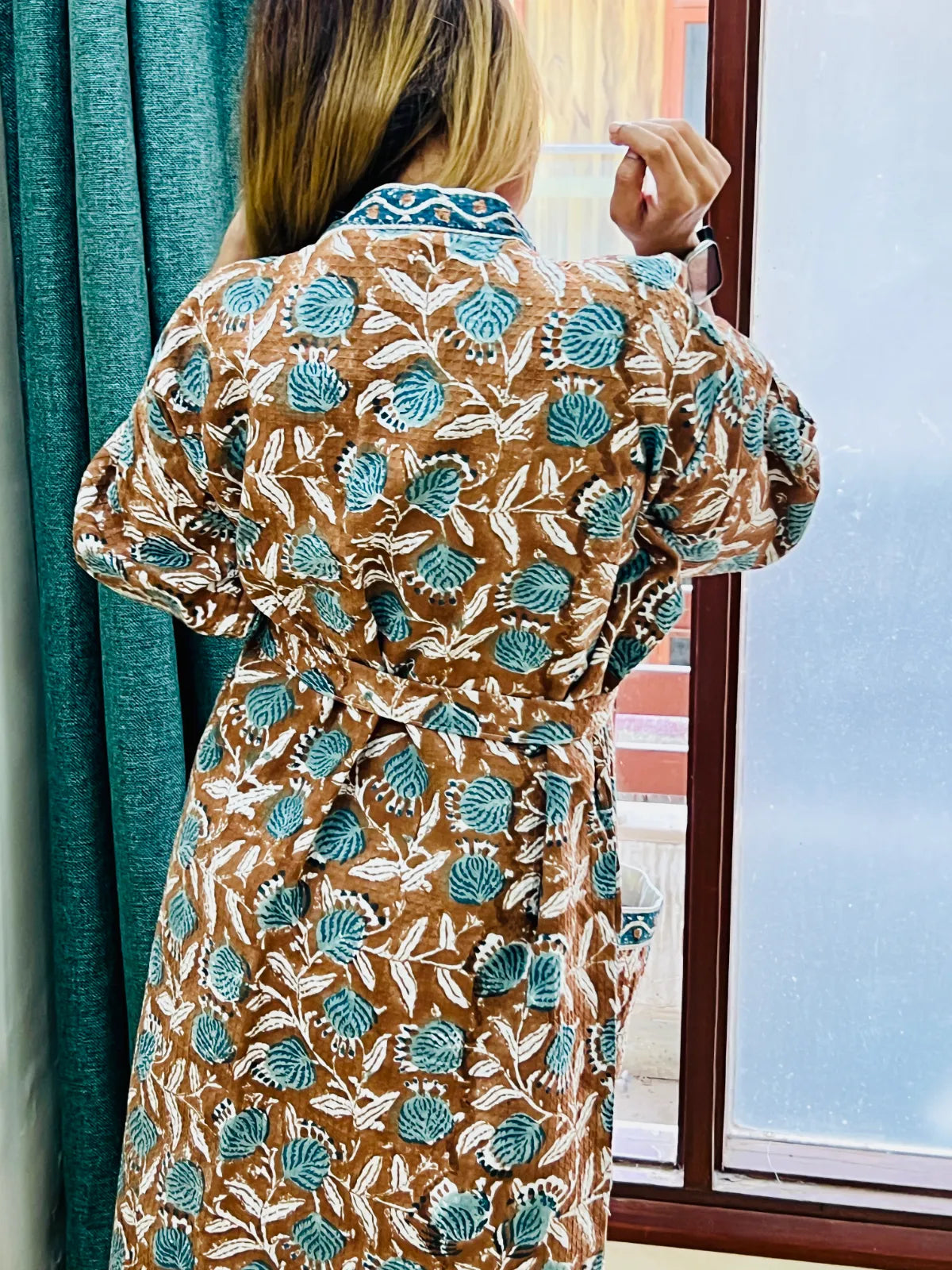 Close-up of the handblock-printed design on the choco brown bathrobe
