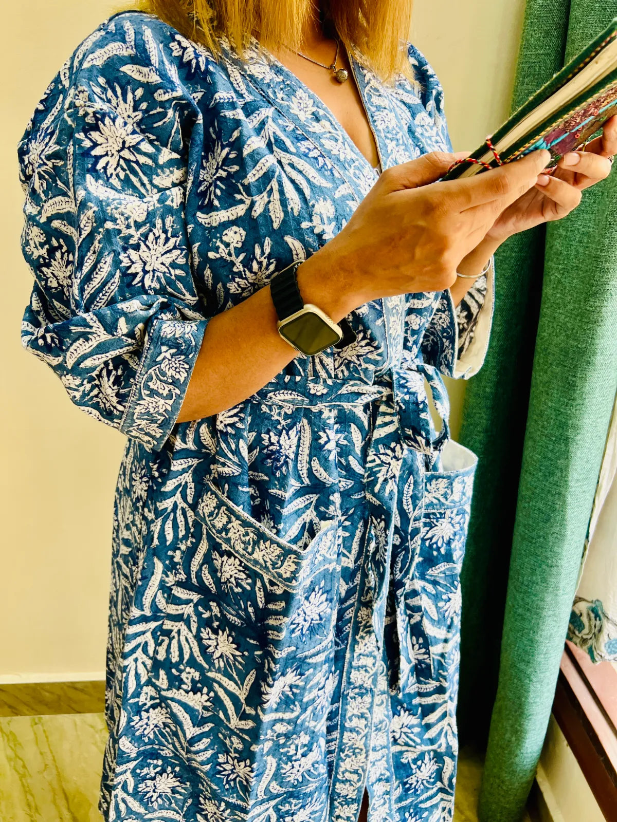 White floral detailing on the navy blue Midnight Bloom bathrobe